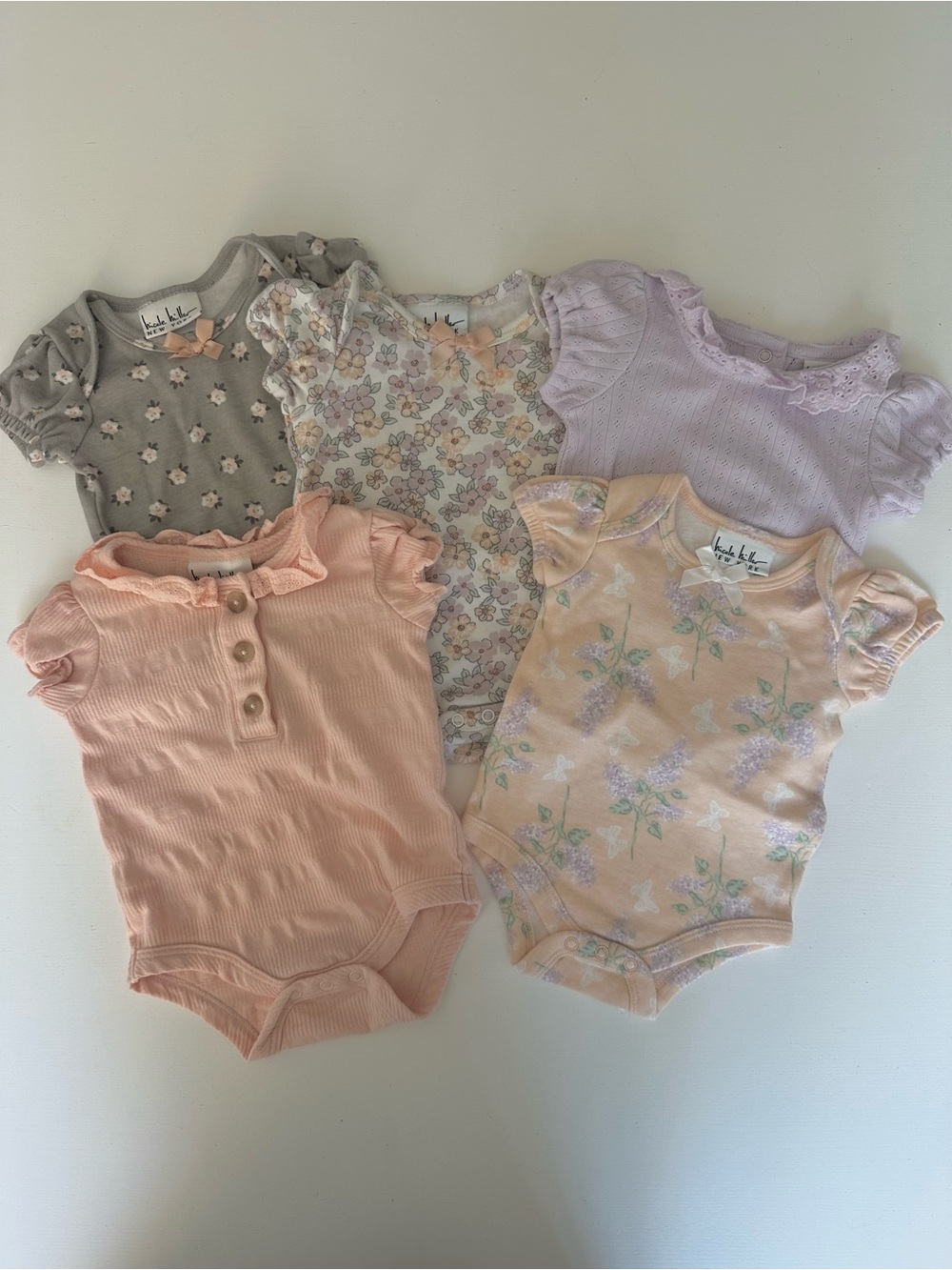Nicole Miller Pastel Peach, Lilac, Gray & Floral Baby One-Piece Bundle